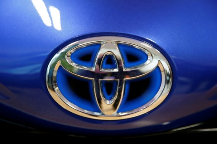 Toyota nine-month net profit dives 30%, cuts forecast