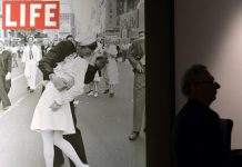 The sailor pictured kissing a woman in Times Square as people celebrated the end of World War II has died at age 95, his daughter told the Providence Journal. George Mendonsa had a seizure Sunday after falling at an assisted living facility in Middleton, Rhode Island, his daughter Sharon Molleur said. In the famous image, one of four taken by Alfred Eisenstadt for Life magazine, Mendonsa is seen ecstatically bending over and kissing a woman in a white nurse's uniform. The picture was published by Life as "V-J Day in Times Square." Mendonsa, who served in the Pacific during World War II, was on home leave when the picture was taken. He had long claimed to be the sailor in the picture, but it wasn't confirmed until recently with the use of facial recognition technology. Greta Zimmer Friedman, the woman in the picture, died in 2016 at age 92. Eisenstadt did not get the names of the kissing strangers. He later described watching the sailor running along the street, and grabbing any girl in sight. "I was running ahead of him with my Leica looking back over my shoulder but none of the pictures that were possible pleased me," he wrote in "Eisenstadt on Eisenstadt." "Then suddenly, in a flash, I saw something white being grabbed. I turned around and clicked the moment the sailor kissed the nurse. If she had been dressed in a dark dress I would never have taken the picture." Mendonsa, who served in the Pacific during World War II, was on home leave when the picture was taken.