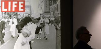 The sailor pictured kissing a woman in Times Square as people celebrated the end of World War II has died at age 95, his daughter told the Providence Journal. George Mendonsa had a seizure Sunday after falling at an assisted living facility in Middleton, Rhode Island, his daughter Sharon Molleur said. In the famous image, one of four taken by Alfred Eisenstadt for Life magazine, Mendonsa is seen ecstatically bending over and kissing a woman in a white nurse's uniform. The picture was published by Life as "V-J Day in Times Square." Mendonsa, who served in the Pacific during World War II, was on home leave when the picture was taken. He had long claimed to be the sailor in the picture, but it wasn't confirmed until recently with the use of facial recognition technology. Greta Zimmer Friedman, the woman in the picture, died in 2016 at age 92. Eisenstadt did not get the names of the kissing strangers. He later described watching the sailor running along the street, and grabbing any girl in sight. "I was running ahead of him with my Leica looking back over my shoulder but none of the pictures that were possible pleased me," he wrote in "Eisenstadt on Eisenstadt." "Then suddenly, in a flash, I saw something white being grabbed. I turned around and clicked the moment the sailor kissed the nurse. If she had been dressed in a dark dress I would never have taken the picture." Mendonsa, who served in the Pacific during World War II, was on home leave when the picture was taken.