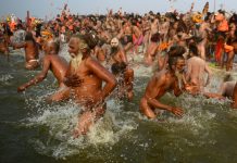 Millions of Hindu pilgrims took the plunge into sacred rivers at the world's largest religious gathering Monday, led by ash-smeared holy men and accompanied by religious chanting. On the most auspicious day of the months-long Kumbh Mela festival, devotees rose at dawn in the northern city of Allahabad to immerse themselves at the confluence of three rivers -- the Ganges, the Yamuna, and the mythical Saraswati. Thousands of Naga Sadhus, a devout, fierce and famously nude sect of followers of the Hindu god Shiv, and other holy men clad in saffron robes, led the mass bathing in the chilly waters, some brandishing swords and tridents. Hindus believe that bathing in the sacred rivers cleanses them of sin and Monday's Mauni Amavasya Snan -- the "no moon day" -- is considered the holiest of the gigantic 48-day festival that runs until March 4. More than 30,000 police were on duty to manage the huge crowds and prevent the deadly stampedes that have marred previous gatherings. Authorities have spent about $40 million on an operation to block drains and make sure others undergo special cleansing so that waste water pouring into the rivers does not threaten the pilgrims. AFP / SANJAY KANOJIA Pilgrims have been streaming into a temporary tent city three times the size of Manhattan island to participate in the festival's high point Special skimmer boats collected waste from the surface of the rivers and more than 40,000 temporary toilets have been installed. Pilgrims have been streaming into a temporary tent city -- three times the size of Manhattan island -- in buses, trains and cars to participate in the festival's high point. The confluence of the three rivers is considered especially holy and Hindus believe bathing there during the Kumbh helps cleanse sins and bring salvation. Nearly 12 million people attended the inaugural bathing ritual on January 15 and about 120 million are expected during the whole festival. Devotees meditate on the banks of the rivers after the dip and collect Ganges water in cans to take home. Many observe complete silence for the rest of the day after their ritual bath. According to Hindu mythology, gods and demons fought a war over a sacred pitcher, or kumbh, containing the nectar of immortality. During the clashes, a few drops fell to earth at four different locations -- one being Allahabad. The historic city was recently renamed Prayagraj by the state's Hindu government but is still widely known as Allahabad, the name it was given by Muslim rulers hundreds of years ago.