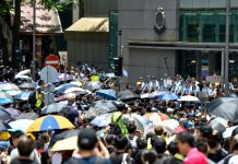 Thousands converge on Hong Kong police HQ in anti-govt demo