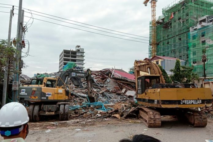 Three dead, dozens feared buried in Cambodia building collapse