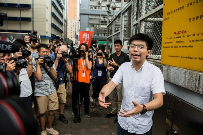Hong Kong activist Joshua Wong leaves jail, vows to join protests