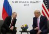 With a smile, Trump tells Putin 'don't meddle in the election'