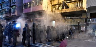Tear gas fired at Hong Kong protesters close to Beijing's office