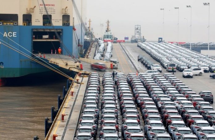 Geely cars for export enter a cargo vessel at Ningbo Zhoushan port in Zhejiang province