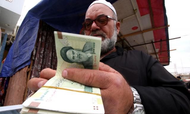 seller of Iranian currency, before the start of the U.S. sanctions on Tehran, in Basra