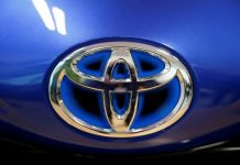 Toyota nine-month net profit dives 30%, cuts forecast