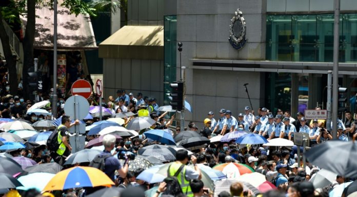 Thousands converge on Hong Kong police HQ in anti-govt demo