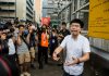 Hong Kong activist Joshua Wong leaves jail, vows to join protests