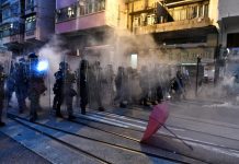 Tear gas fired at Hong Kong protesters close to Beijing's office