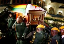 Zimbabwe's president says Mugabe died of cancer